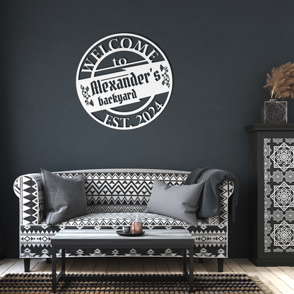 Alexanders_BackYard_BBQ_Metal_Sign_White_Dark_Living_Room_Mockup.png